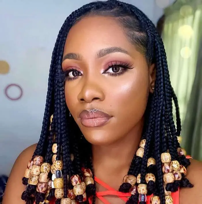 See 18 Alluring Knotless Braids With Beads Hairstyles - Africana Fashion