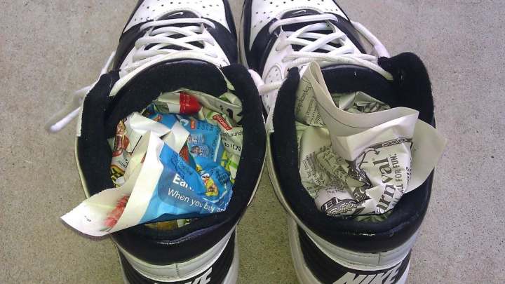 soaking wet shoes with newspaper